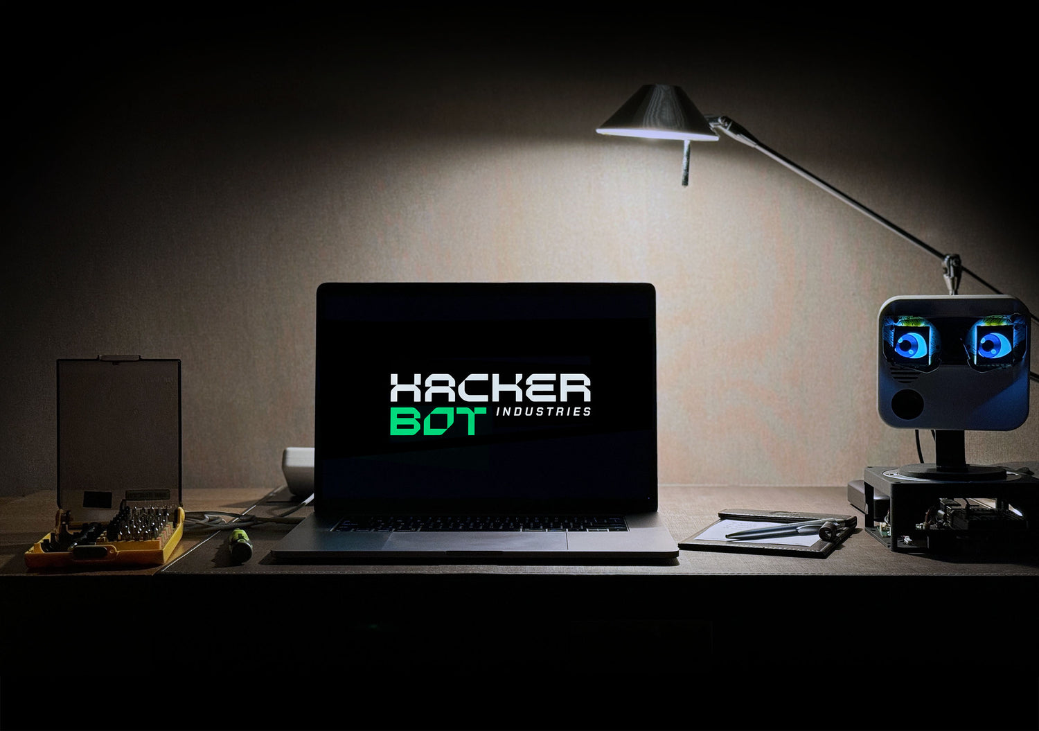 Hackerbot Industries desk with a laptop and robot